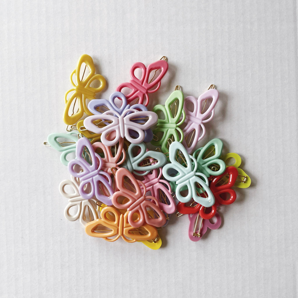 Pile of color butterfly hair clips for girls and toddler